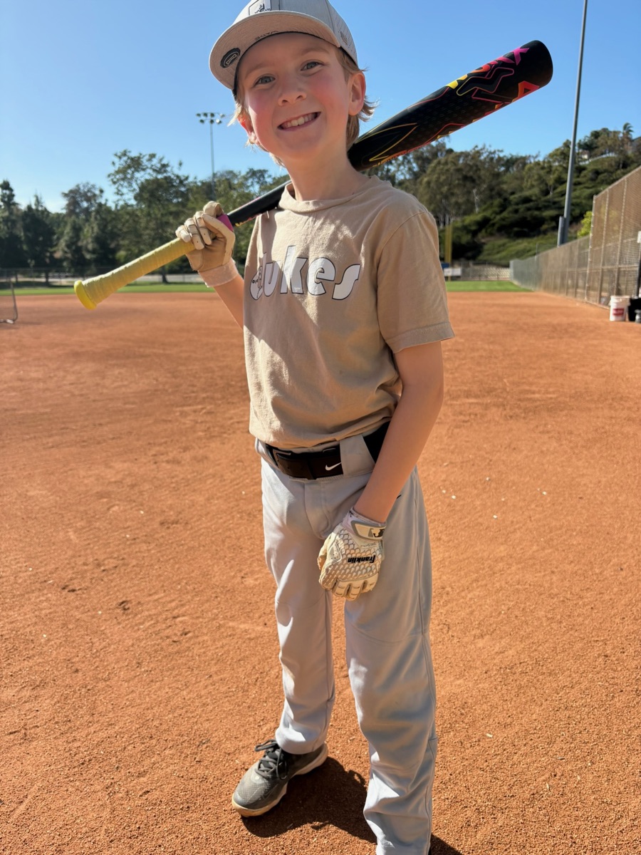 Young Dukes player with his bat