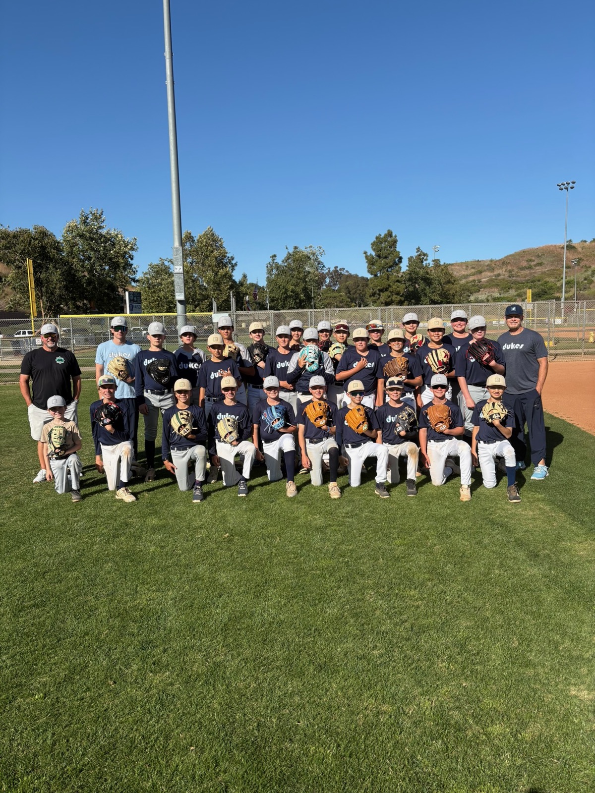 Dukes team photo on the field